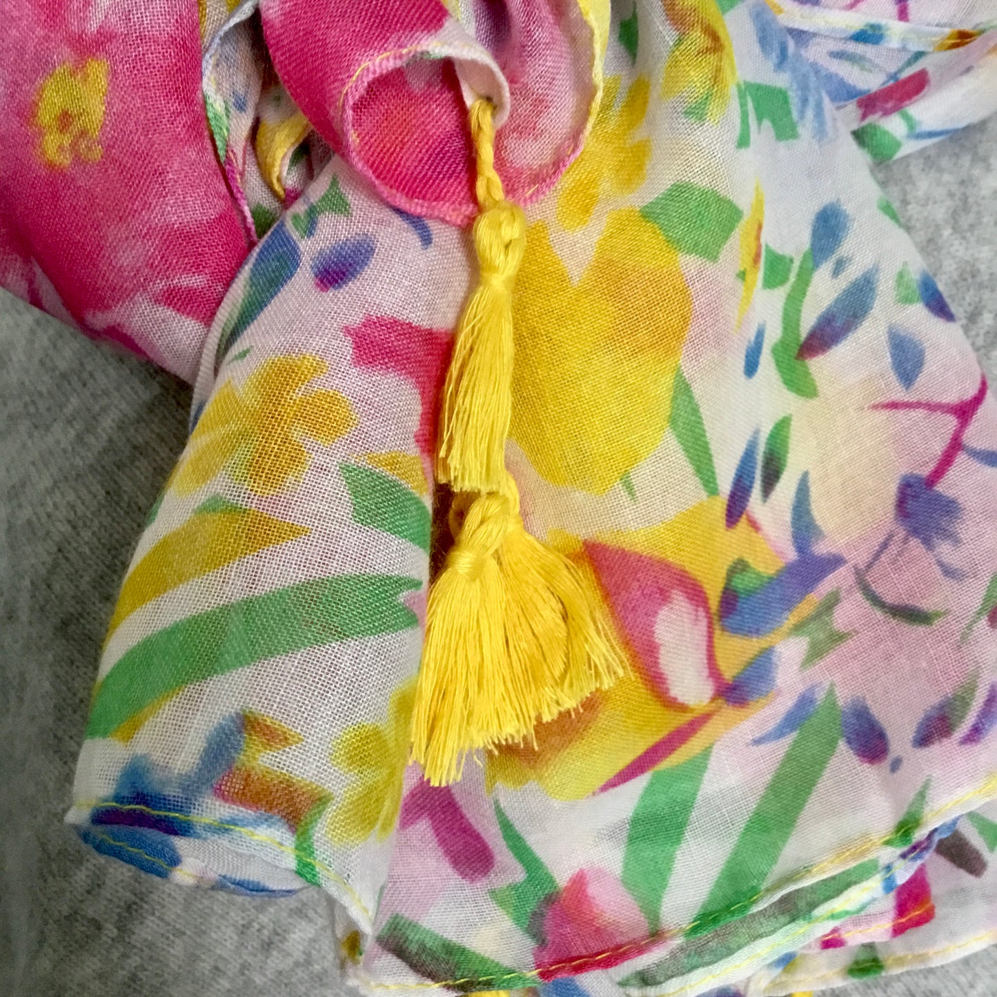 Bright floral scarf with yellow tassels