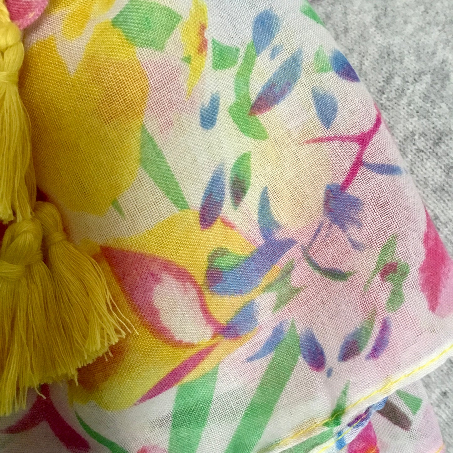 Bright floral scarf with yellow tassels